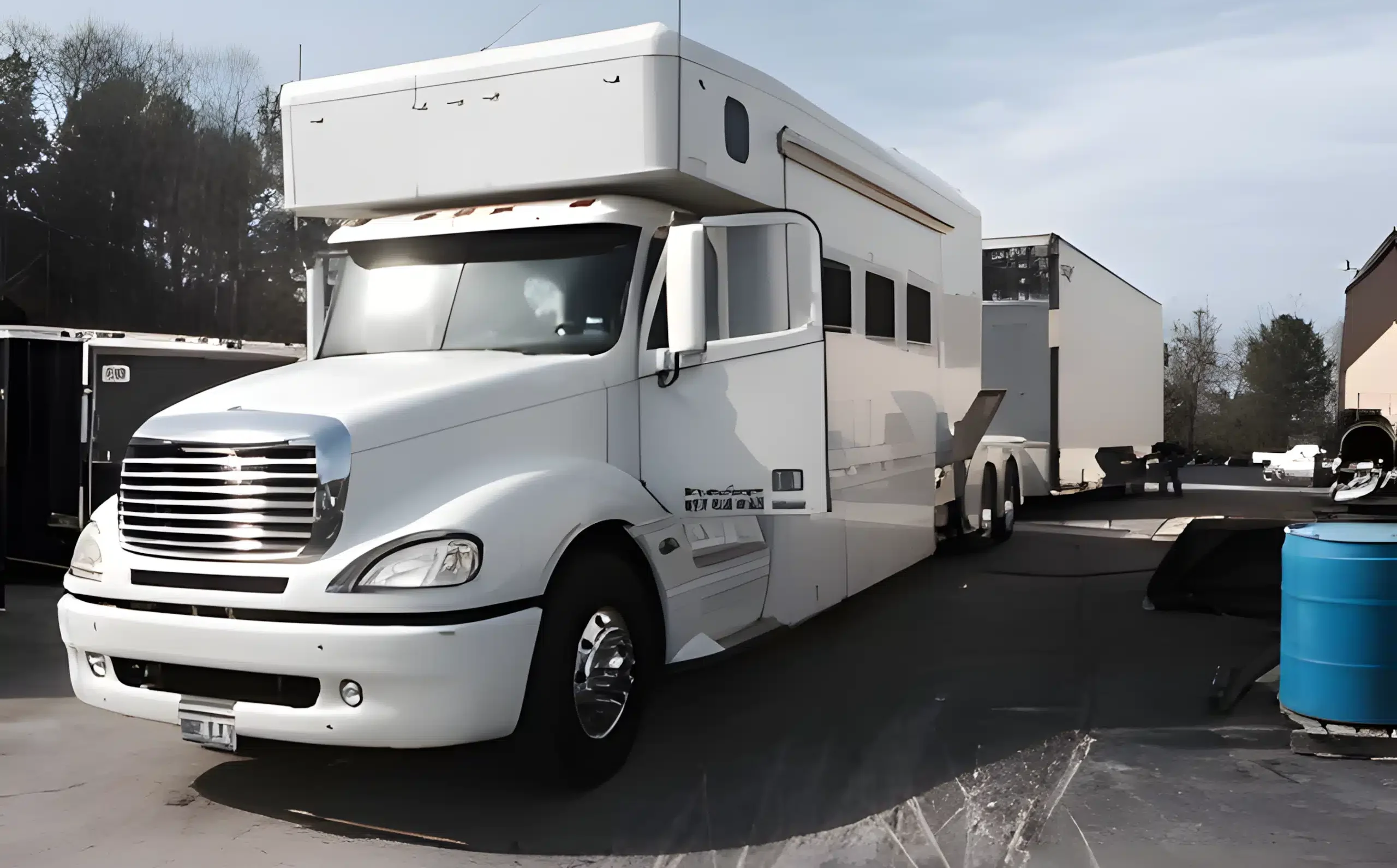 a white truck with a trailer