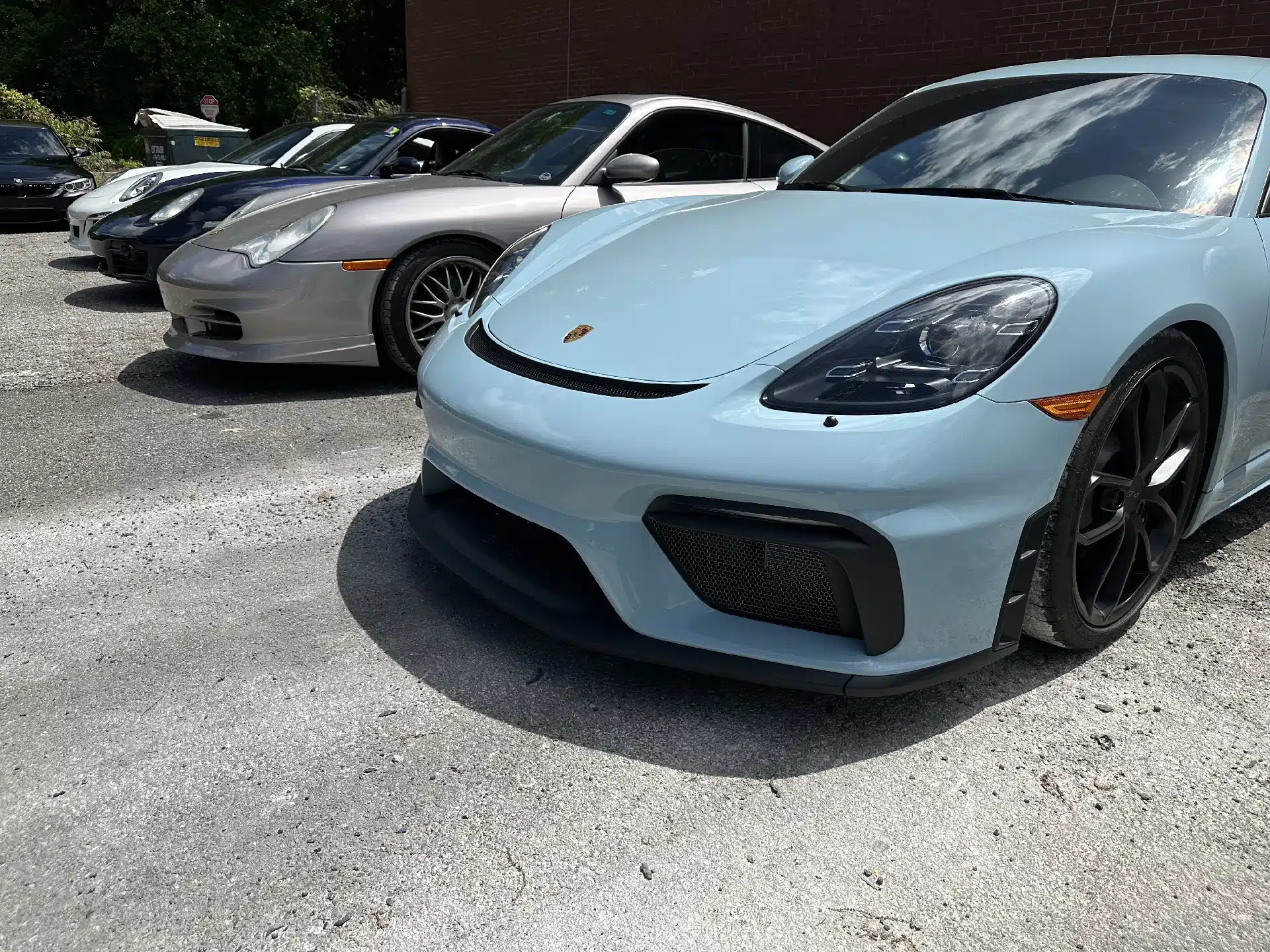 Porsche repair and maintenance in Gainesville, GA by Atlanta Speedwerks. Image of a light blue Porsche Cayman parked, showcasing the car's sleek design and suitability for daily driving with proper care and maintenance.