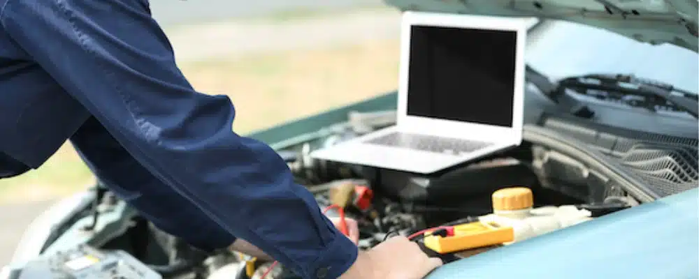 a man working on a car