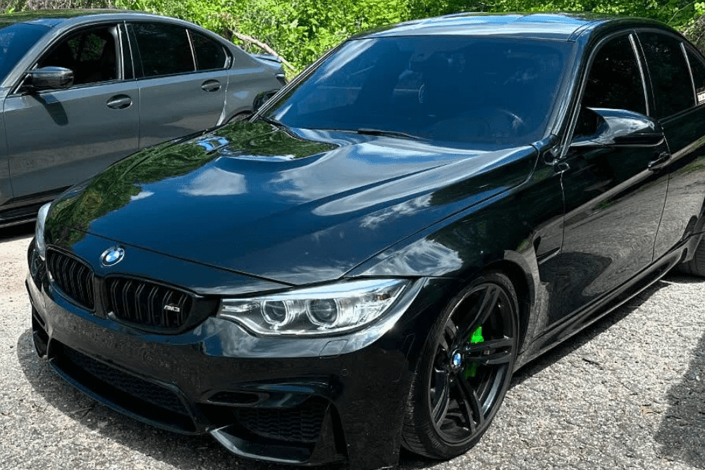 BMW, MINI, and EV maintenance, auto repair in Gainesville, GA by Atlanta Speedwerks. Image of a black BMW sedan parked outdoors, showcasing performance upgrades and precision European auto care.