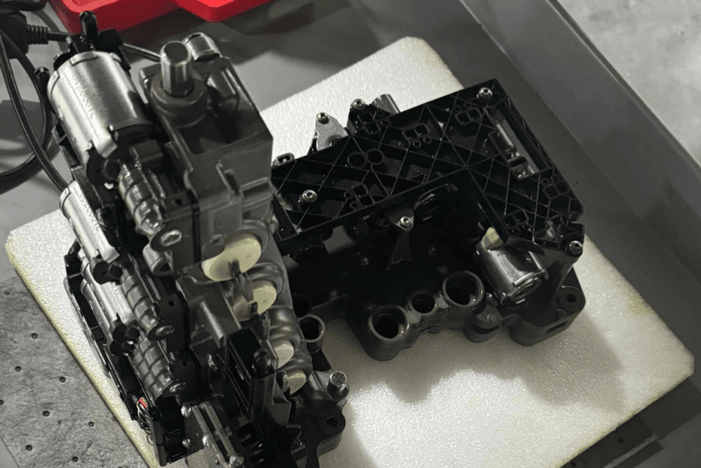 Image showing precision work on a transmission control module, emphasizing the shop’s expertise in European car performance and reliability.