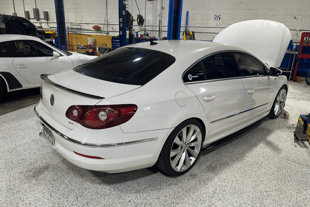Suspension and brake problems, European auto repair in Gainesville, GA by Atlanta Speedwerks. Image of a Volkswagen sedan in a professional shop setting, highlighting precision diagnostics, maintenance, and specialized care for European vehicles to ensure peak performance and reliability.