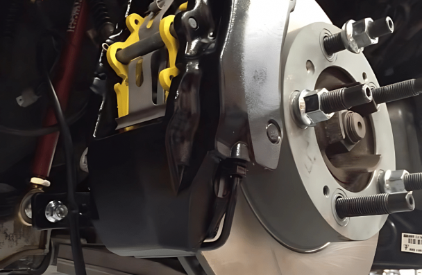 Car Accessories, Car Accessories, Auto Repair in Gainesville, GA at Atlanta Speedwerks. Image of a vehicle’s upgraded brake system, featuring precision-installed rotors and calipers.