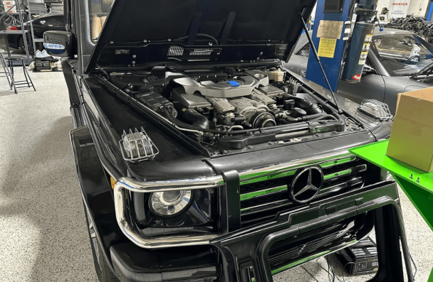 European auto repair specialist in Gainesville, GA by Atlanta Speedwerks. Image showing a black Mercedes G-Wagon with the hood open during engine diagnostics, emphasizing professional European auto repair and maintenance services.
