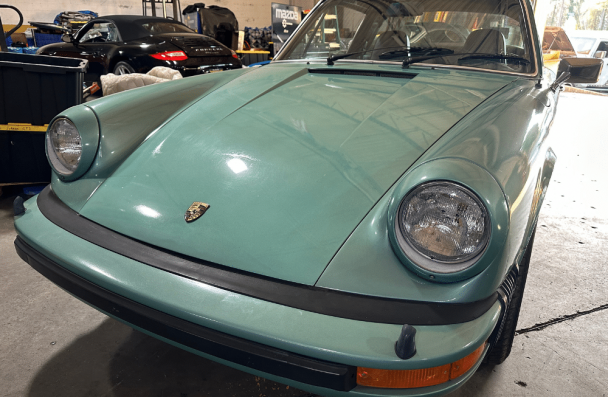 headlights, auto repair in Gainesville, GA at Atlanta Speedwerks. Close-up image of a vintage Porsche 911 featuring well-maintained headlights.