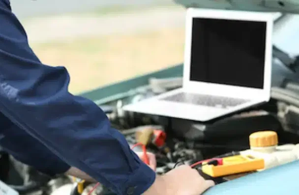 a man working on a car